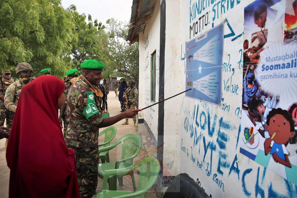 KDF TROOPS IN SOMALIA DONATE DESKS AND FOOD TO LOCALS IN CELEBRATION OF KDF DAY
